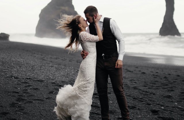 wedding photographer captured a beautiful just married couple on the beach