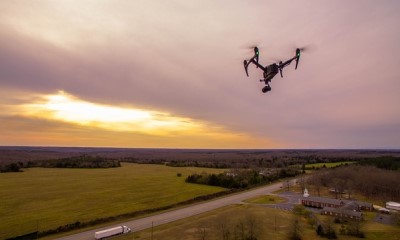 image showing drone in the sky launched by wedding videographer to capture a beautiful wedding venue